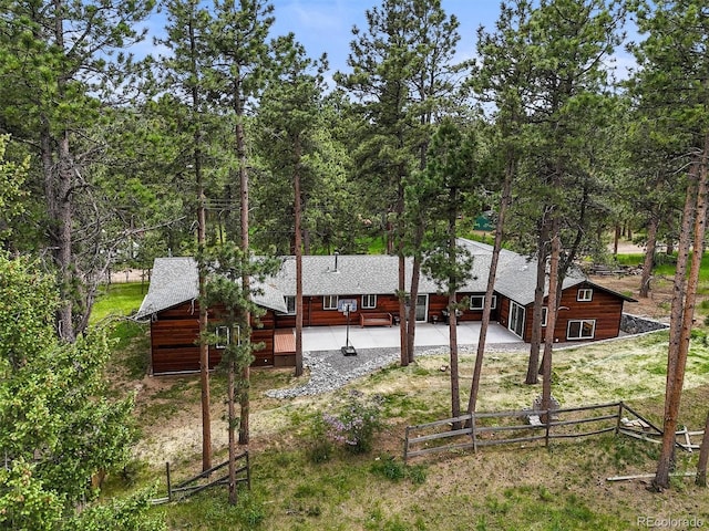 26499 W St, Conifer, CO 80433 - rear view of house featuring a patio area and roof with shingles
