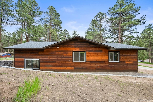 26499 W St, Conifer, CO 80433 - view of property exterior featuring a shingled roof