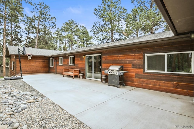26499 W St, Conifer, CO 80433 - back of property featuring a patio and roof with shingles
