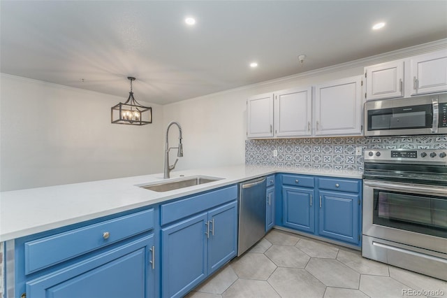 12118 W Dorado Pl Unit 206, Littleton, CO 80127 - kitchen featuring stainless steel appliances, light countertops, white cabinets, hanging light fixtures, and crown molding