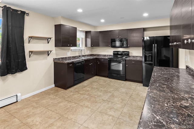 kitchen featuring black appliances, a sink, dark stone counters, baseboard heating, and recessed lighting