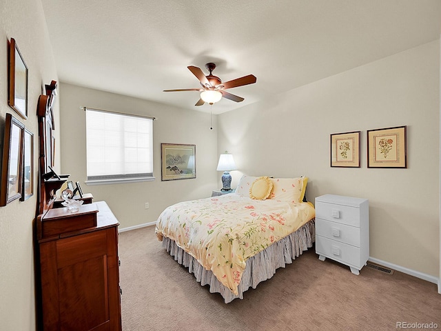 10565 Kicking Horse Dr, Littleton, CO 80125 - bedroom featuring light carpet, baseboards, and ceiling fan