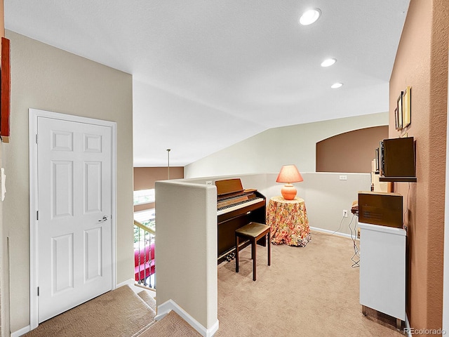 10565 Kicking Horse Dr, Littleton, CO 80125 - office area featuring light carpet, vaulted ceiling, recessed lighting, and baseboards