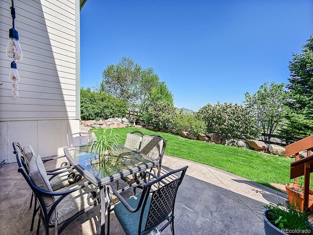 10565 Kicking Horse Dr, Littleton, CO 80125 - view of patio / terrace featuring outdoor dining space