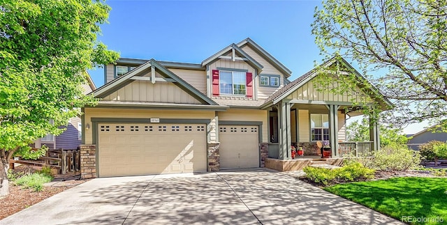 10565 Kicking Horse Dr, Littleton, CO 80125 - craftsman house with covered porch, board and batten siding, driveway, stone siding, and a garage