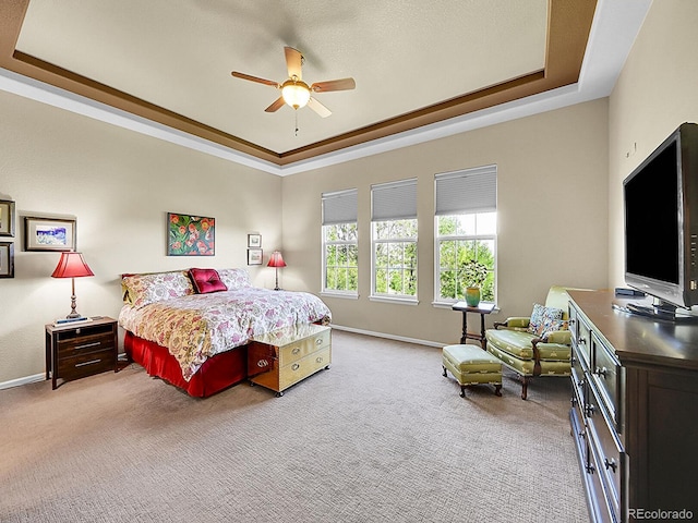 10565 Kicking Horse Dr, Littleton, CO 80125 - bedroom featuring a tray ceiling, light carpet, and a ceiling fan