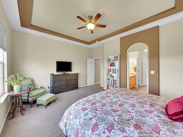 10565 Kicking Horse Dr, Littleton, CO 80125 - carpeted bedroom with a raised ceiling, arched walkways, and ceiling fan