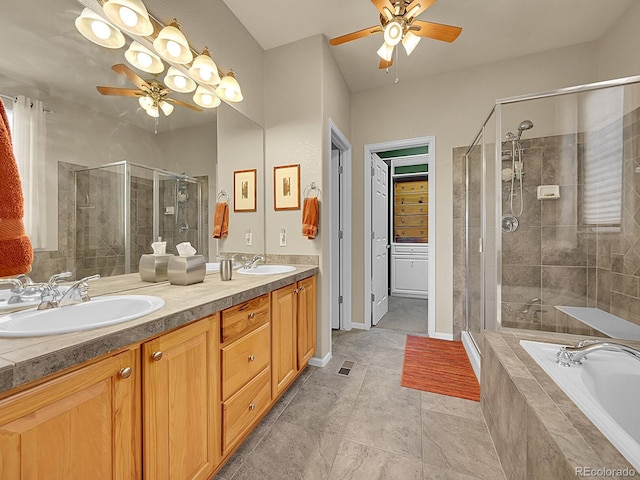 10565 Kicking Horse Dr, Littleton, CO 80125 - bathroom featuring ceiling fan, double vanity, a shower stall, a bath, and tile patterned floors