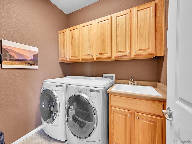 10565 Kicking Horse Dr, Littleton, CO 80125 - washroom featuring cabinet space, washing machine and dryer, and a textured wall
