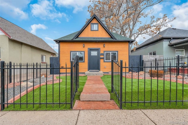 bungalow-style house featuring a front yard