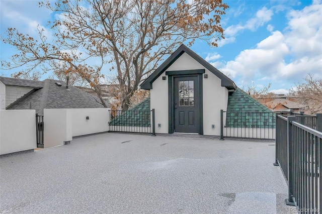 view of outdoor structure with fence and a gate