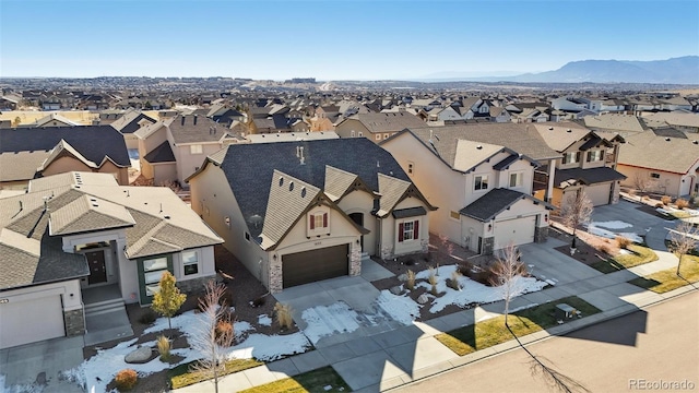 birds eye view of property featuring a mountain view