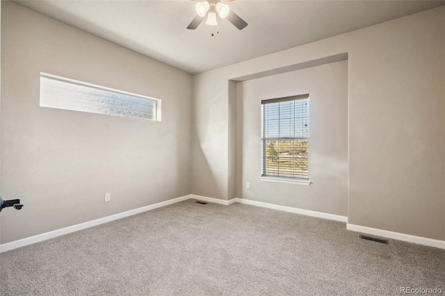 unfurnished room with carpet and ceiling fan