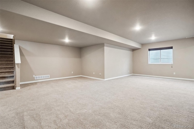 basement featuring carpet floors