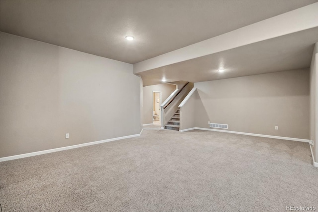 basement with light colored carpet