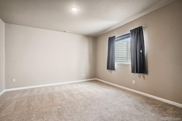 unfurnished room featuring carpet flooring