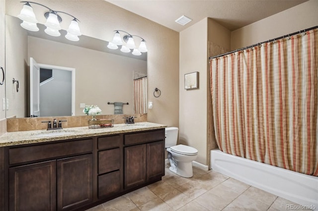 full bathroom featuring tile patterned flooring, vanity, shower / bath combo, and toilet