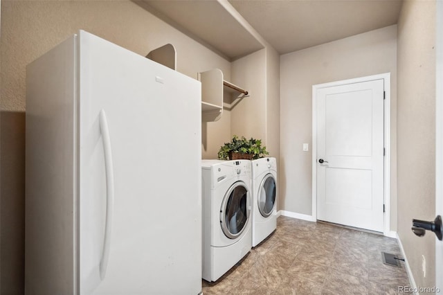 laundry area with independent washer and dryer