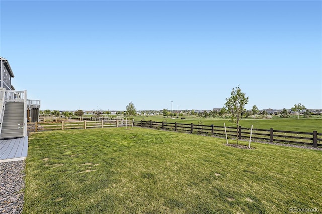 7702 E 159th Ave, Thornton, CO 80602 - view of yard with a rural view and stairway