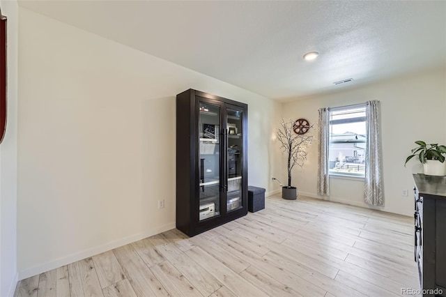 7702 E 159th Ave, Thornton, CO 80602 - unfurnished room featuring light wood-style flooring and baseboards