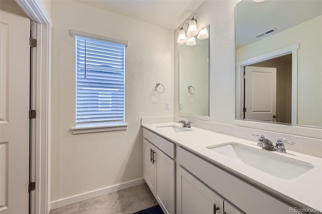 7702 E 159th Ave, Thornton, CO 80602 - full bathroom with double vanity and baseboards