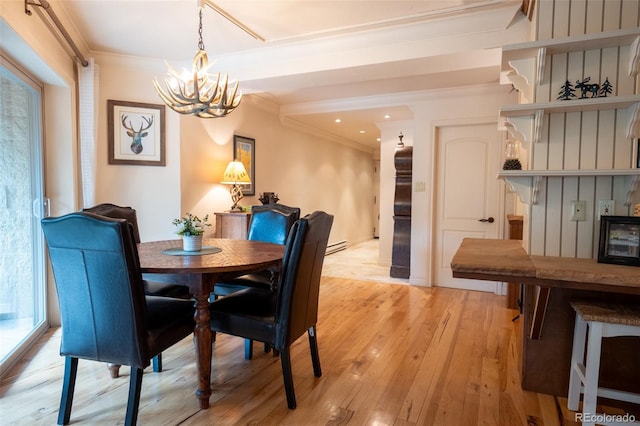 765 Columbine St Unit C203, Breckenridge, CO 80424 - dining area featuring a chandelier, ornamental molding, light wood-style flooring, and recessed lighting