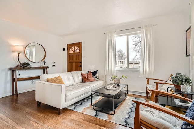 living area featuring wood finished floors and baseboards