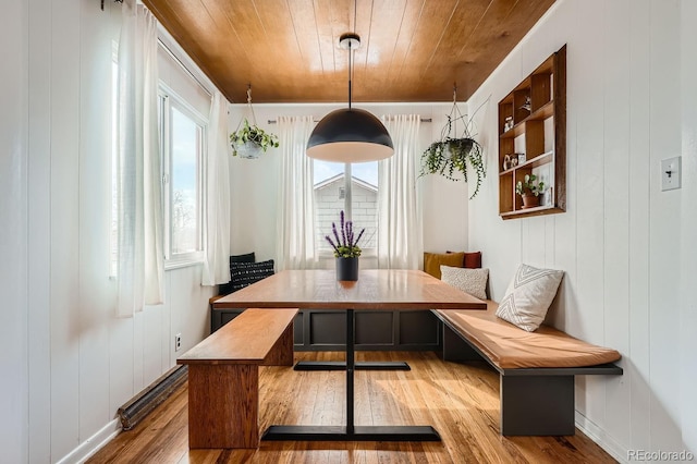 dining area with wood ceiling, breakfast area, and hardwood / wood-style floors