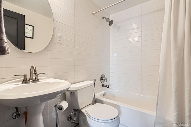 bathroom with toilet, shower / bath combination with curtain, decorative backsplash, and tile walls