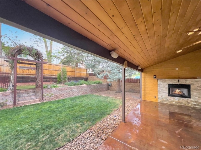 7217 S Zephyr Way, Littleton, CO 80128 - view of yard featuring a patio and an outdoor stone fireplace