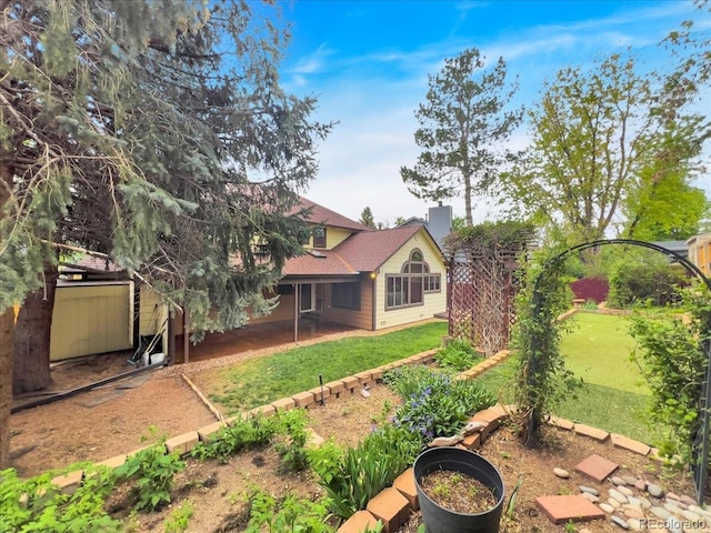 7217 S Zephyr Way, Littleton, CO 80128 - view of green lawn with a patio area