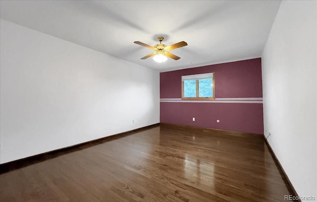 7217 S Zephyr Way, Littleton, CO 80128 - spare room featuring wood finished floors, ceiling fan, and baseboards