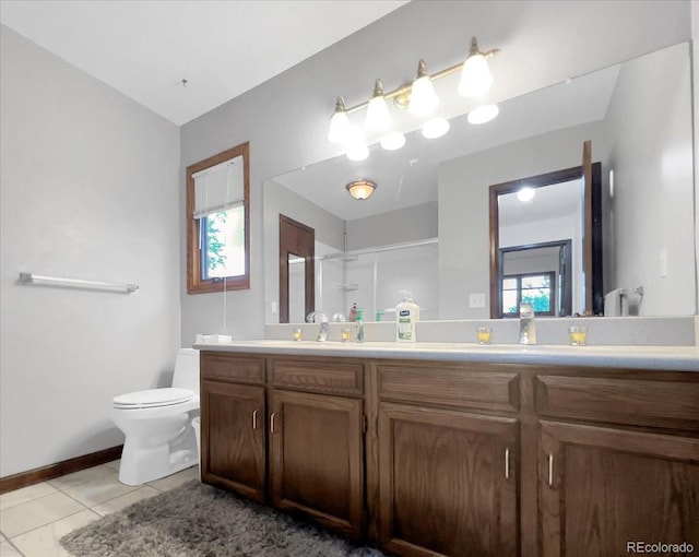 7217 S Zephyr Way, Littleton, CO 80128 - full bath with toilet, tile patterned flooring, double vanity, a shower, and healthy amount of natural light