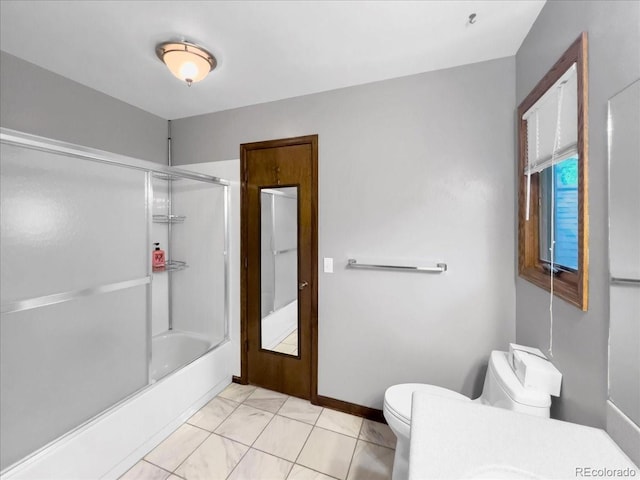 7217 S Zephyr Way, Littleton, CO 80128 - bathroom with toilet, enclosed tub / shower combo, and baseboards