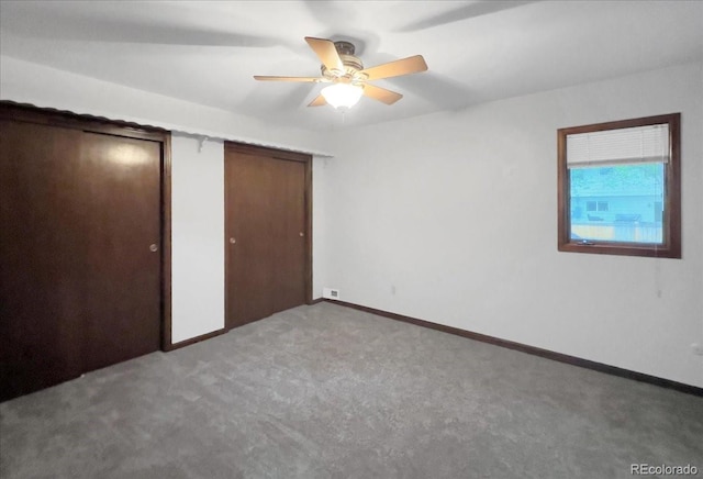 7217 S Zephyr Way, Littleton, CO 80128 - unfurnished bedroom with carpet, baseboards, a ceiling fan, and multiple closets