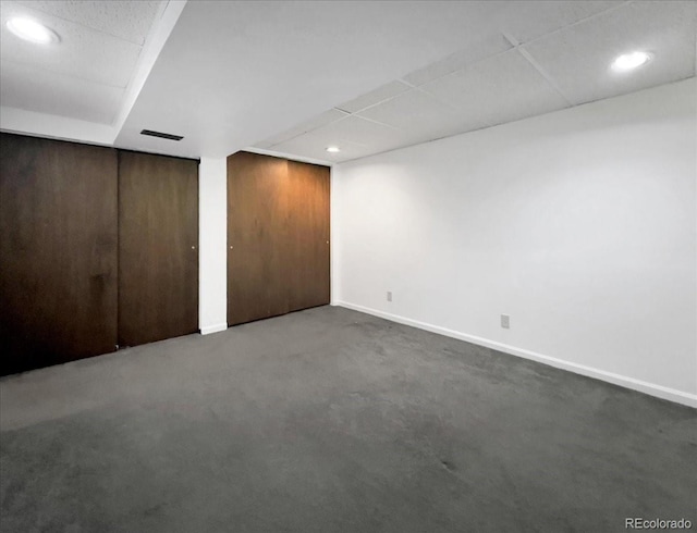7217 S Zephyr Way, Littleton, CO 80128 - unfurnished bedroom with carpet floors, recessed lighting, baseboards, multiple closets, and a paneled ceiling