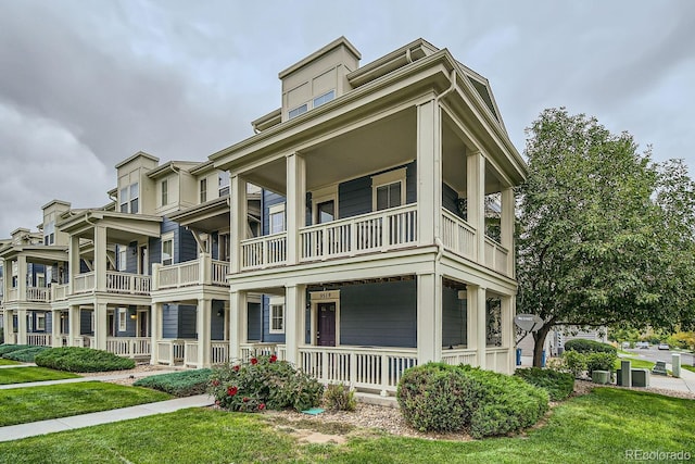 view of front facade featuring a balcony and a porch