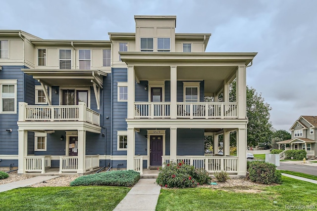 view of front of property featuring a porch and a balcony