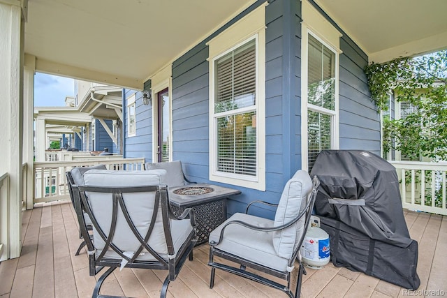 exterior space with a porch and an outdoor fire pit