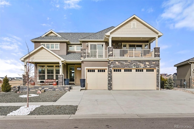 craftsman house featuring a garage and a balcony