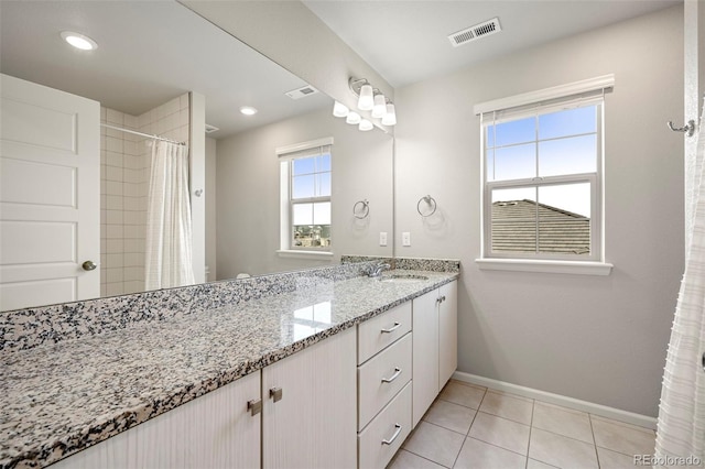 bathroom featuring tile patterned floors and vanity