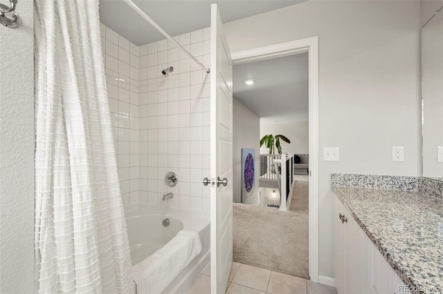 bathroom with tile patterned flooring, vanity, and shower / bath combo