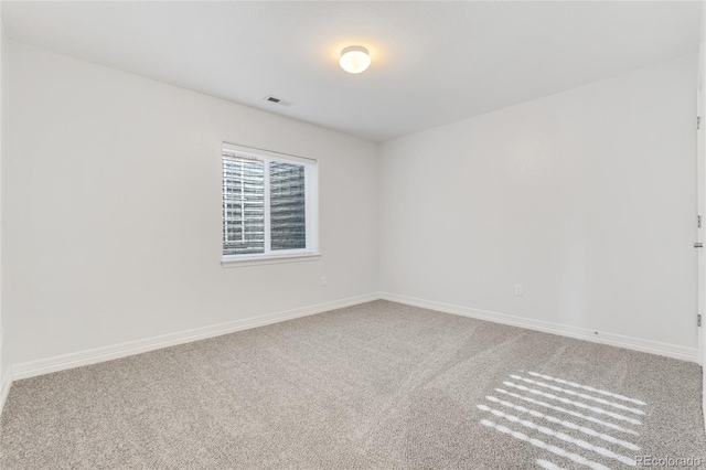 empty room featuring carpet flooring