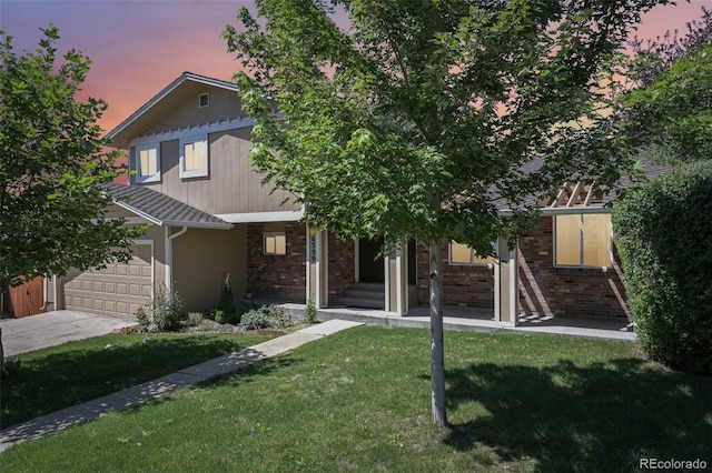 obstructed view of property featuring a yard and a garage