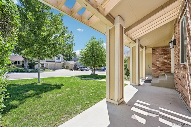 view of yard with covered porch