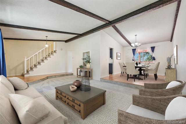 living room featuring high vaulted ceiling, hardwood / wood-style flooring, a chandelier, and beamed ceiling