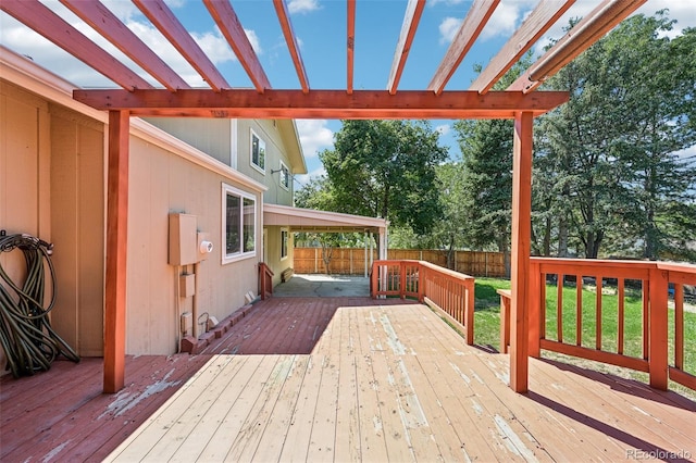 wooden terrace featuring a pergola and a yard