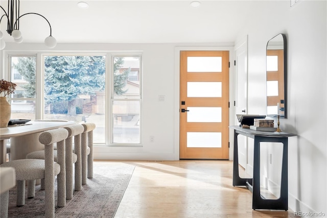 doorway to outside with light hardwood / wood-style floors