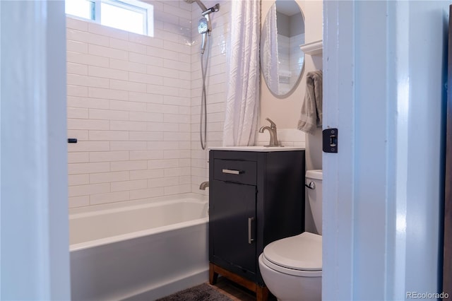 134 S Quitman St, Denver, CO 80219 - bathroom featuring toilet, vanity, and shower / tub combo