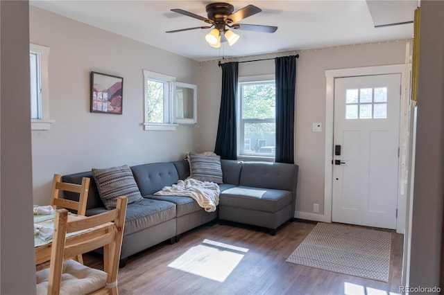 134 S Quitman St, Denver, CO 80219 - living area with wood finished floors, a ceiling fan, and baseboards